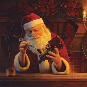 babbo natale dipinge un trenino